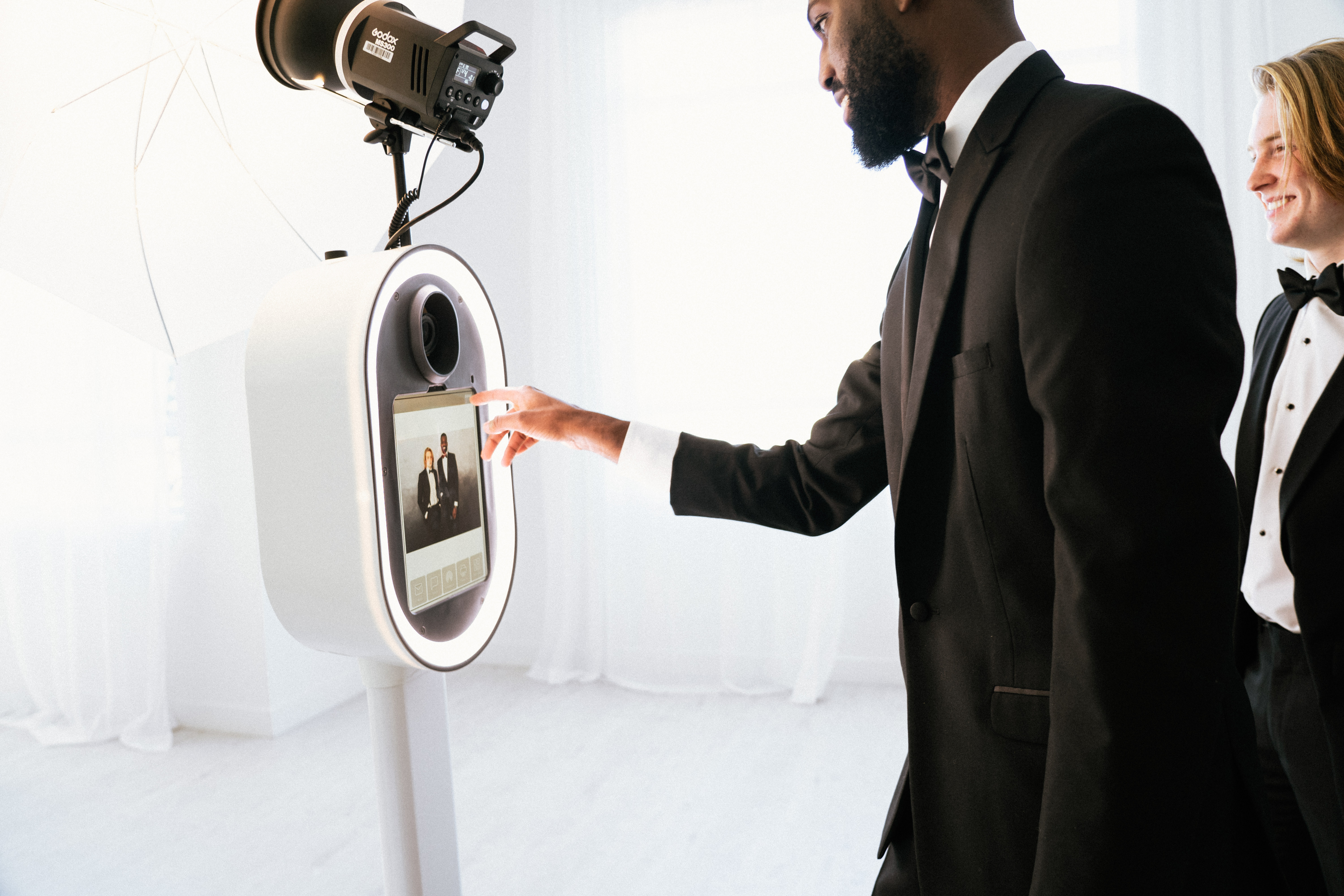 Guests using photo booth